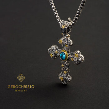 Eden's Garden Eve cross in 18K Gold and Sterling silver with Blue topaz